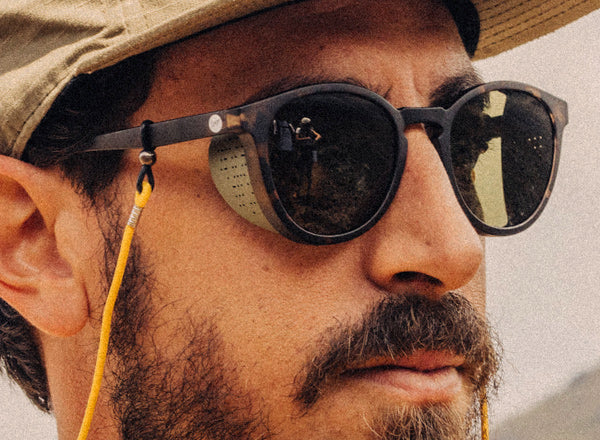 close up of man wearing sunski tera sunglasses