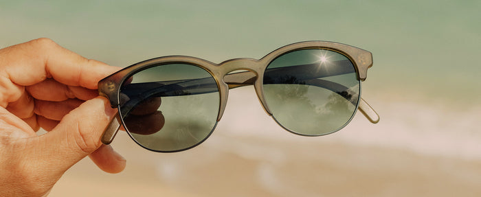 hand holding sunski avila sunglasses
