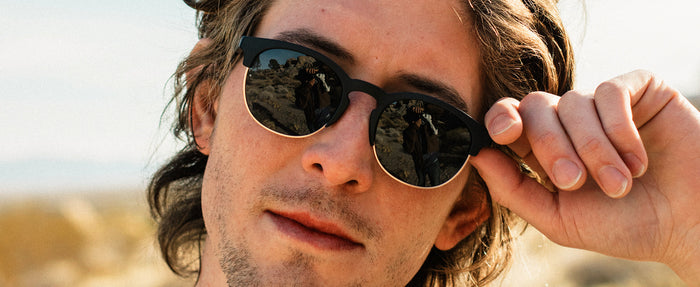 guy with hand up wearing sunski avila sunglasses