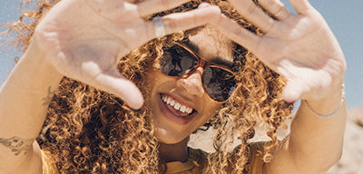 woman in the desert in sunski sunglasses