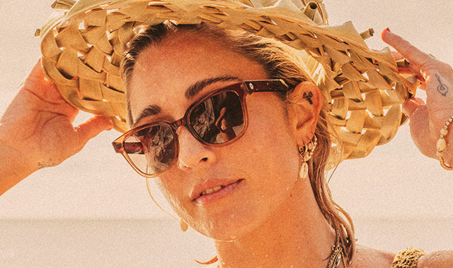 women in sunski sunglasses at the beach