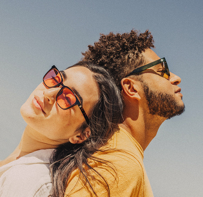 man and woman wearing sunski tinted sunglasses