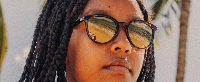 close up of woman wearing sunski makani sunglasses