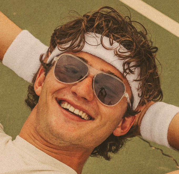 guy smiling wearing sunski polarized sports sunglasses