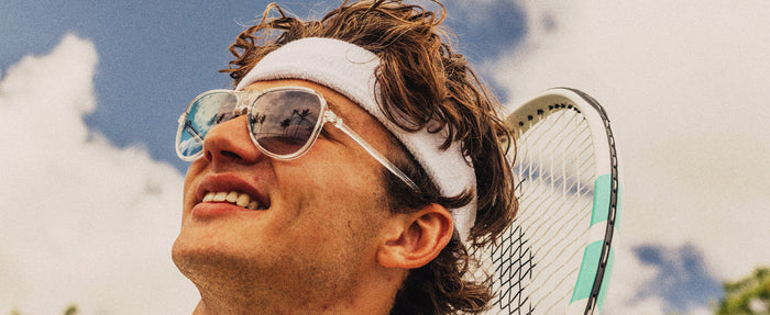 man playing tennis in sunski foxtrot sunglasses