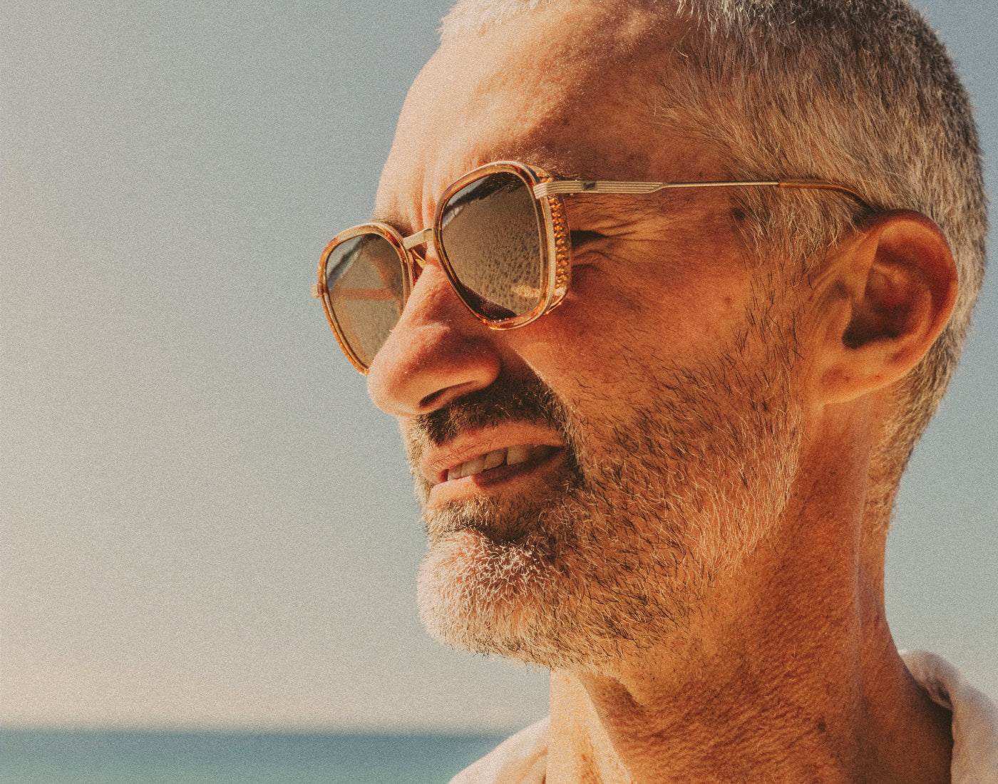 profile of man wearing sunski bernina sunglasses