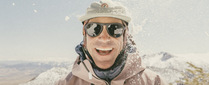 man smiling wearing sunski treeline sunglasses