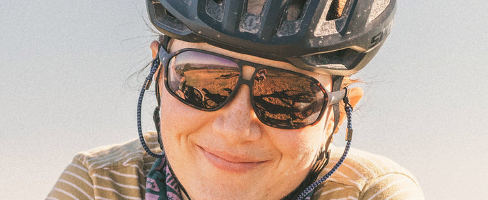 close up of woman wearing sunski velo sunglasses