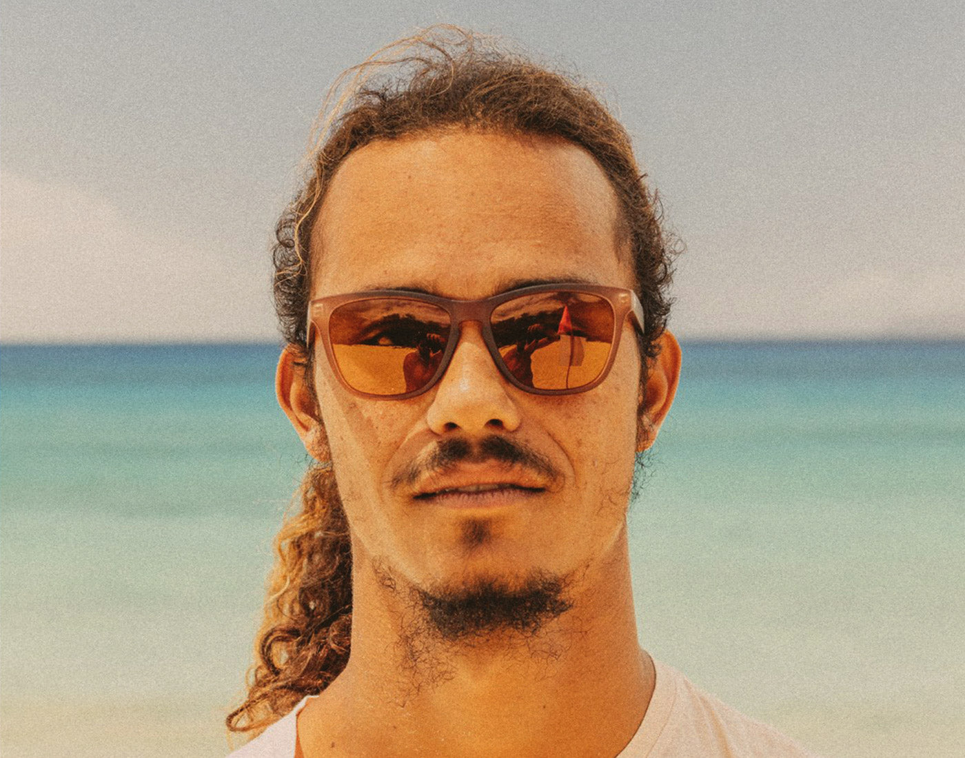 man looking straight on wearing sunski headland sunglasses