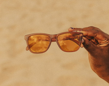 hand holding sunski headland sunglasses