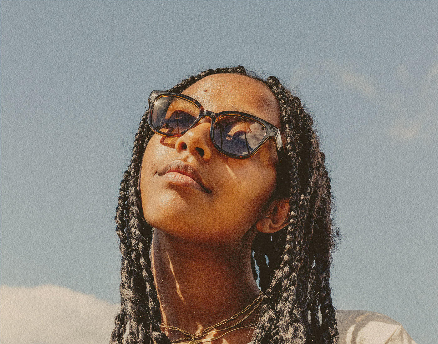 low shot of woman wearing sunski miho sunglasses