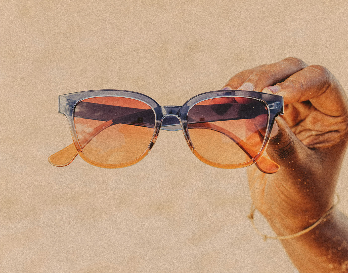 hand holding sunski miho sunglasses