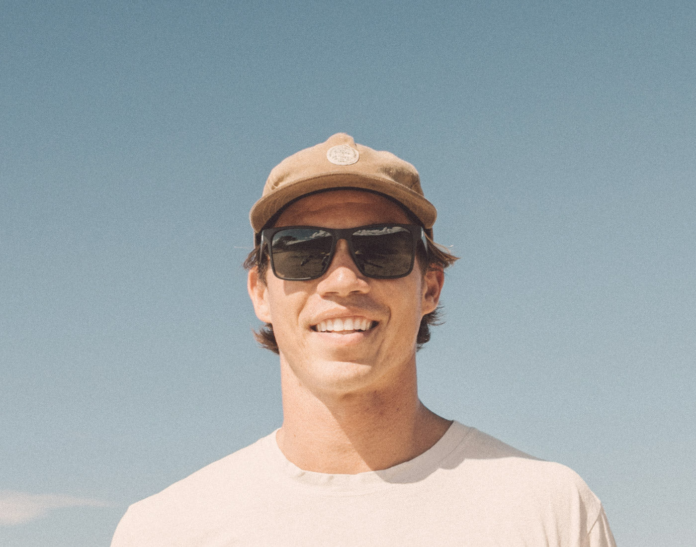 guy smiling wearing sunski puerto sunglasses