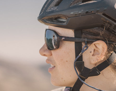 close up profile of person wearing sunski velo sunglasses