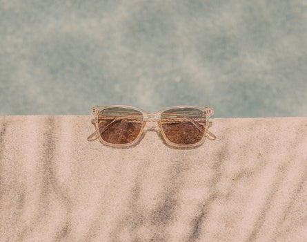 sunski ventana sunglasses on side of pool