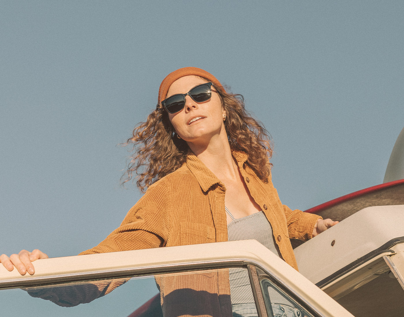 girl coming out of car wearing sunski ventana sunglasses