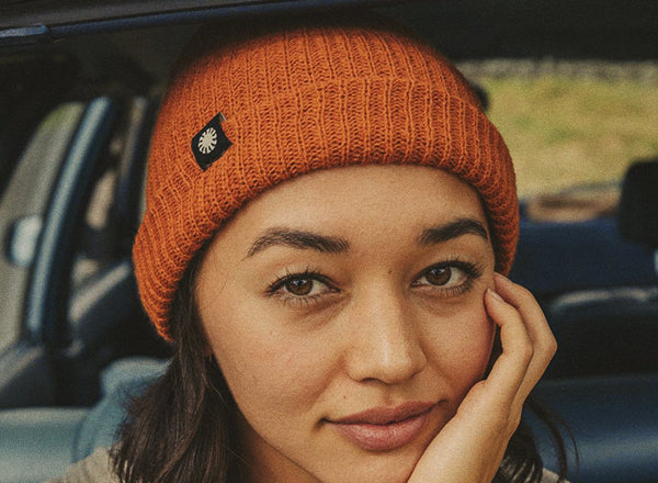 close up of girl wearing sunski shoulder season beanie