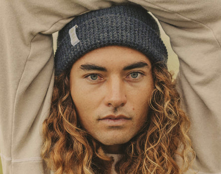 close up of man wearing sunski winter sun beanie