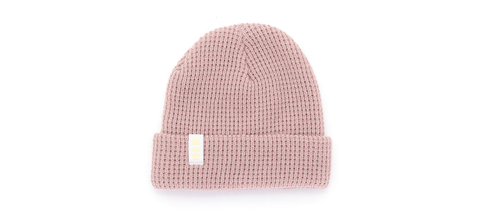 sunski winter sun beanie rose flat lay