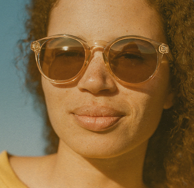woman wearing sunski clear sunglasses