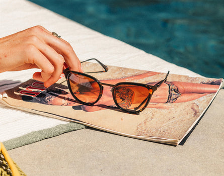 sunski catalina sunglasses next to pool