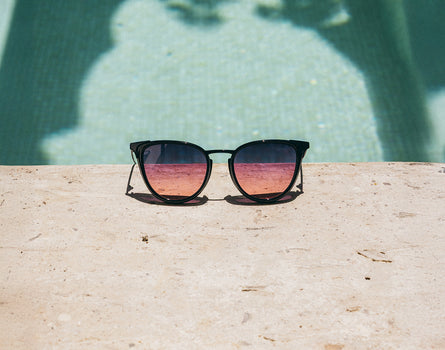 sunski catalina sunglasses next to pool