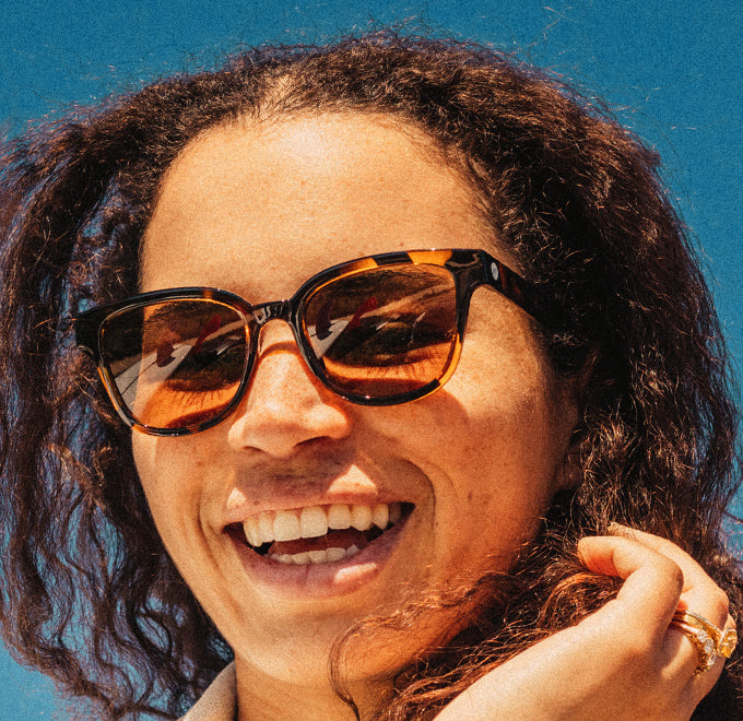 woman laughing wearing sunski polarized sunglasses