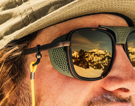close up of sun shields on man wearing sunski ferrata sunglasses