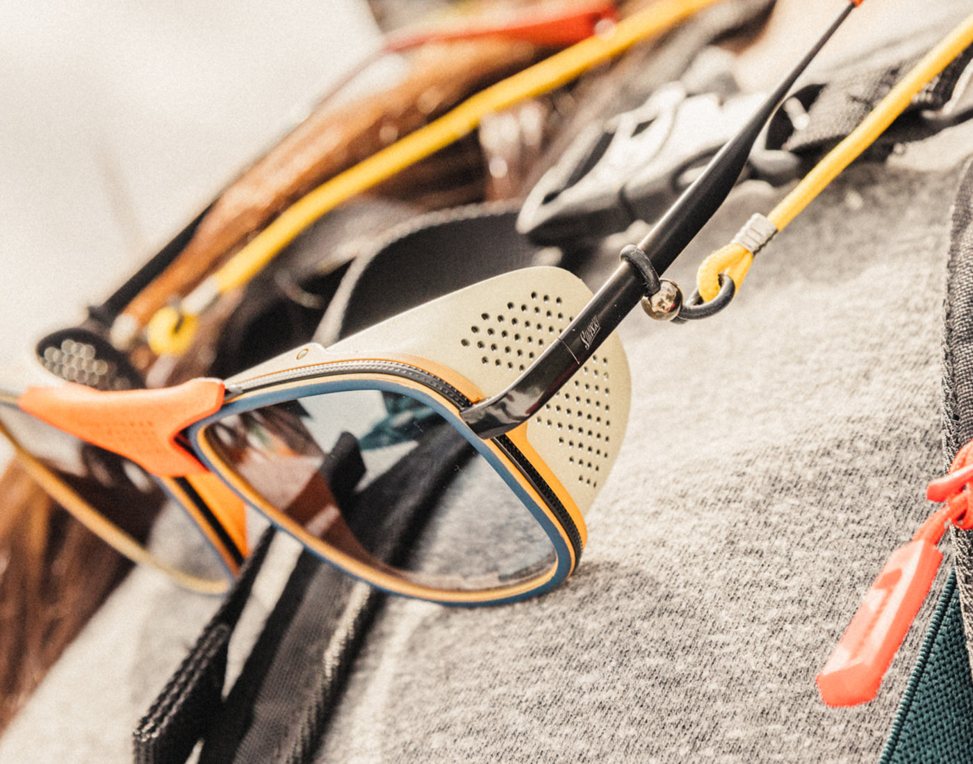close up of sunski ferrata sun shields hanging on lanyard