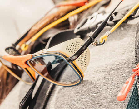 close up of sunski ferrata sun shields hanging on lanyard