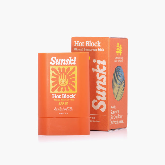 Two Sunsiki Hot Block mineral sunscreen sticks on a white background