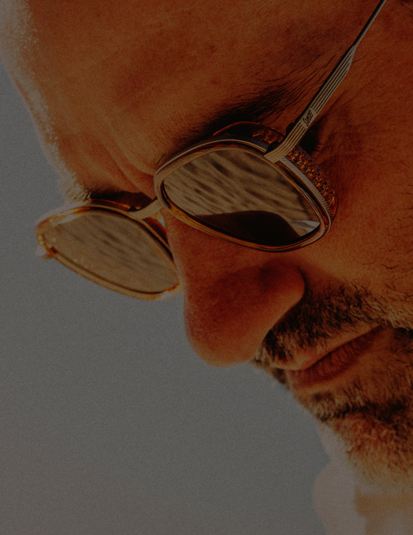 close up of man wearing sunski premium sunglasses