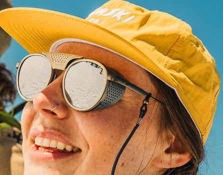 girl wearing sunski strada sunglasses with sun shields on
