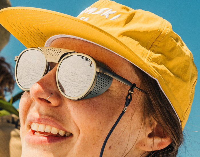 STORY girl wearing sunski strada sunglasses with sun shields on