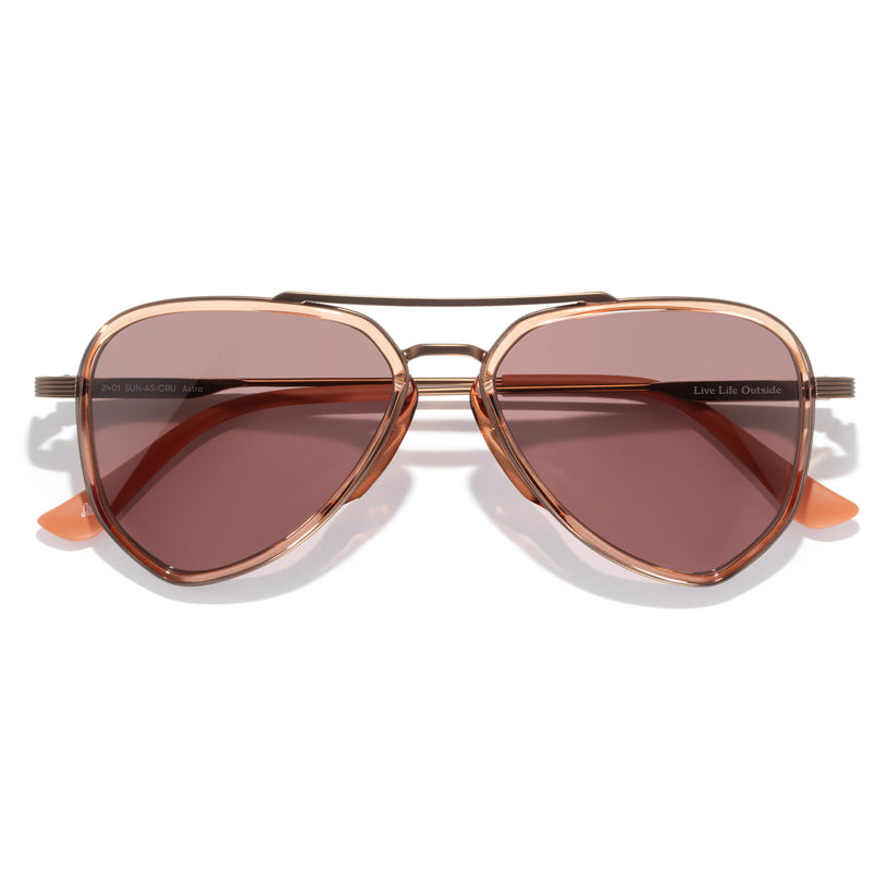 Sunglasses with brown lenses and gold frame on a white background