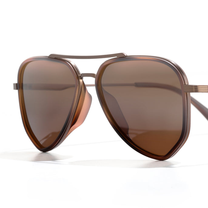 Brown sunglasses with a reflective lens on a white background