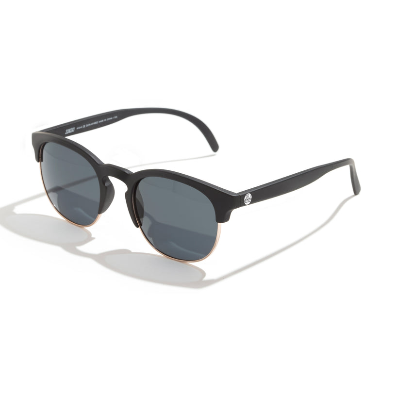 Black sunglasses with a reflective surface on a white background