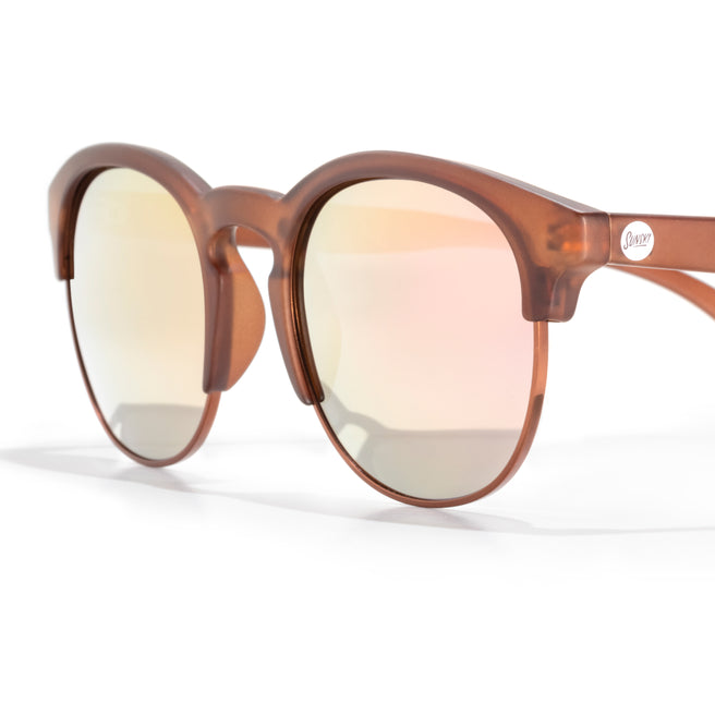 Brown sunglasses with reflective lenses on a white background