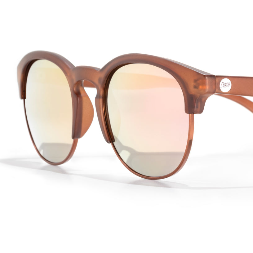 Brown sunglasses with reflective lenses on a white background