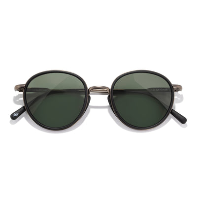 Baia - Black Forest - Round sunglasses with dark lenses on a white background