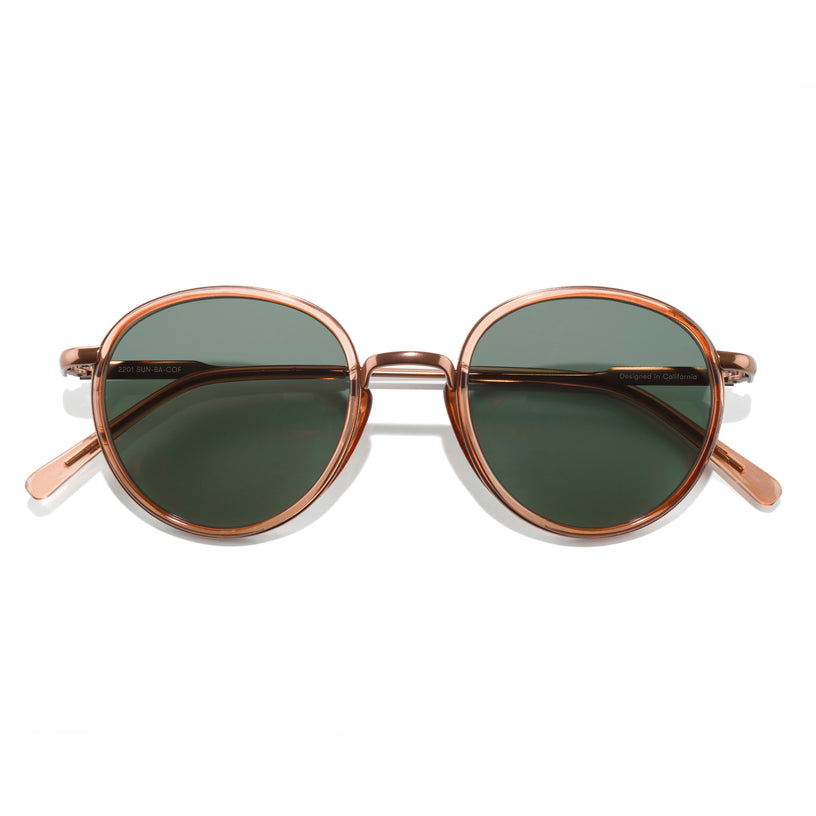 Sunglasses with rose gold frame and dark lenses on a white background