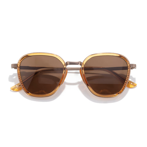 Gold-framed sunglasses with brown lenses on a white background