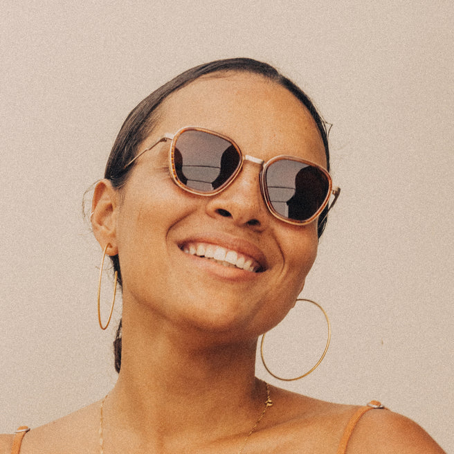 Bernina - Desert Amber - Woman wearing sunglasses with a neutral background