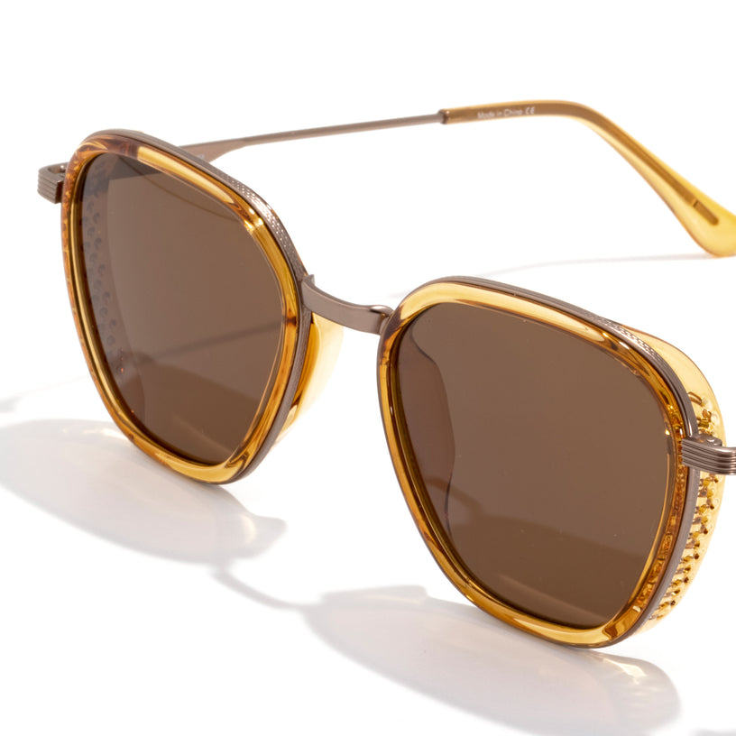 Gold-framed sunglasses with brown lenses on a white background