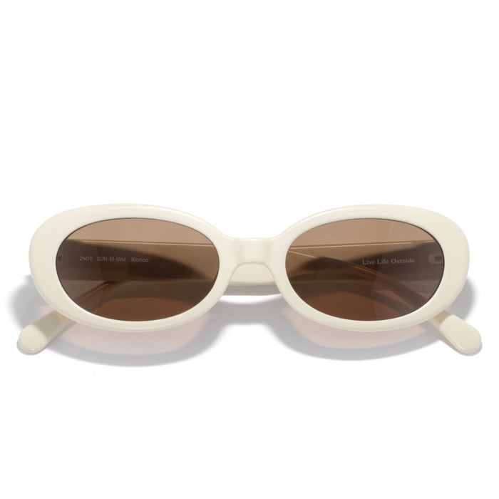 white sunglasses on white background with amber lens