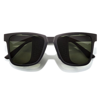 Black sunglasses with dark lenses on a white background