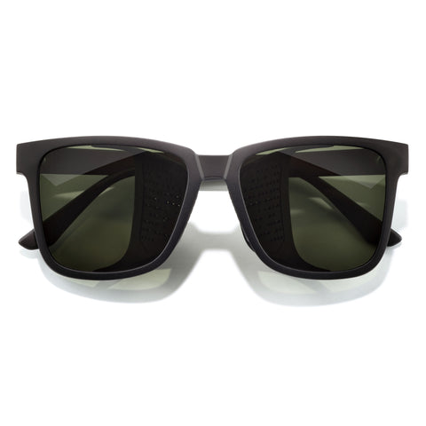 Black sunglasses with dark lenses on a white background