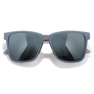 Sunglasses with gray frames and dark lenses on a white background
