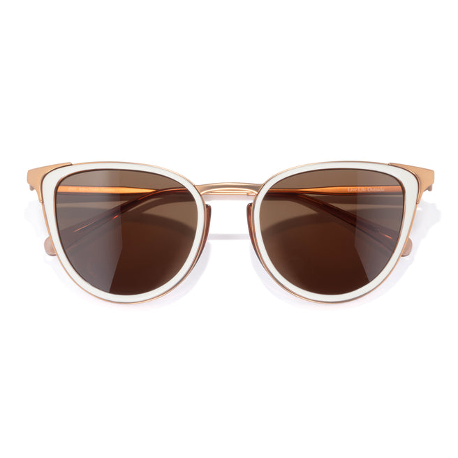 Sunglasses with gold frame and brown lenses on a white background