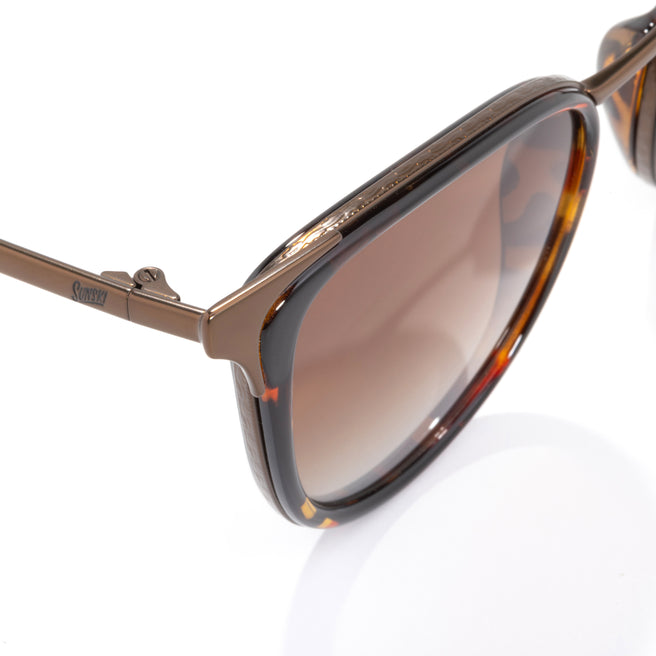 Brown sunglasses with tortoiseshell frame on a white background